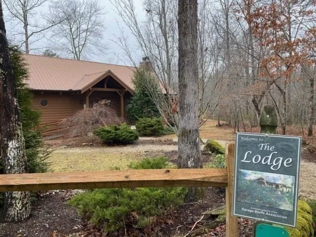 a sign board with yard in front of it