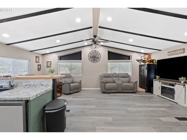 a kitchen with stainless steel appliances granite countertop a sink and cabinets