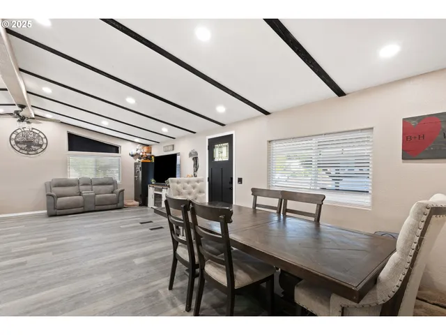a dining room with furniture and window