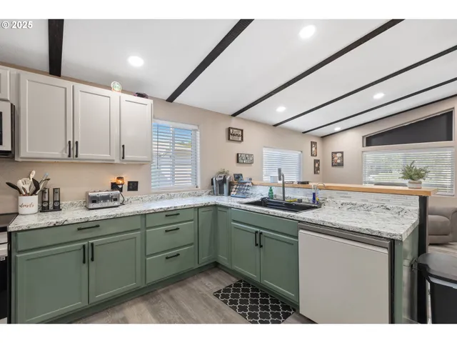 a kitchen with lots of counter space cabinets and appliances