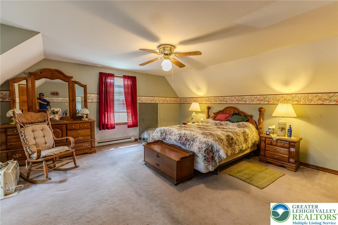 40 Locke Heights Road Bangor, PA 18013 - Photo 22 of 28 A comforting retreat, this bedroom offers carpeted flooring and a convenient ceiling fan for optimal airflow.