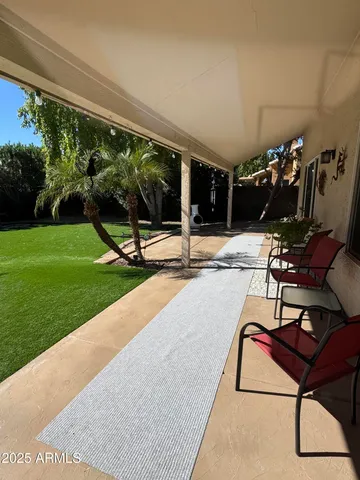 a view of a patio with a backyard