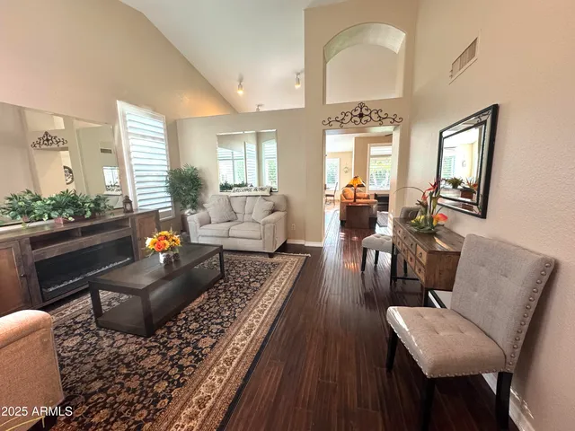 a living room with furniture and a large window