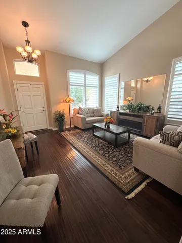 a living room with furniture and a large window