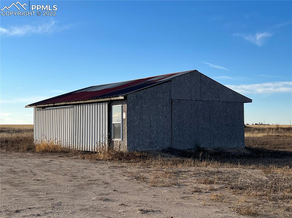 16870 Simla Highway Simla, CO 80835 - Photo 4 of 6 a wooden house with a small yard
