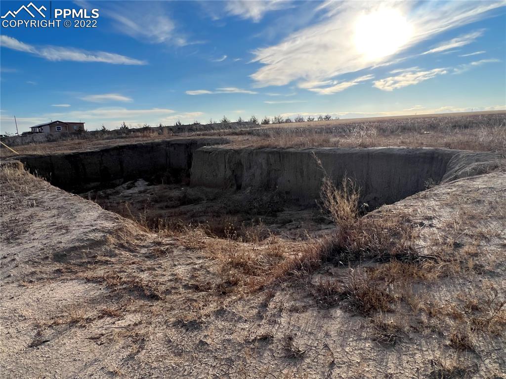 16870 Simla Highway Simla, CO 80835 - Photo 6 of 6 a view of a dry yard with wooden fence