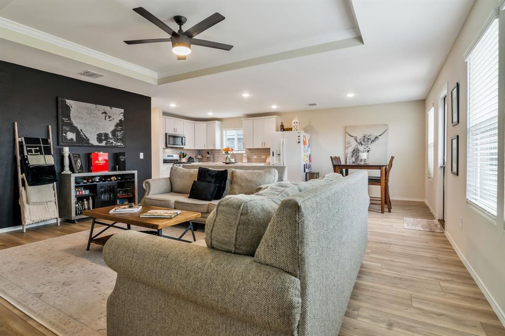 1228 Viscount Street Haslet, TX 76052 - Photo 11 of 28 a living room with furniture and kitchen view