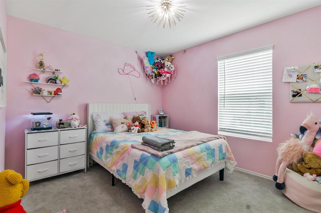 1228 Viscount Street Haslet, TX 76052 - Photo 19 of 28 a bedroom with a bed and a dresser