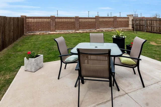 a view of two chairs in patio