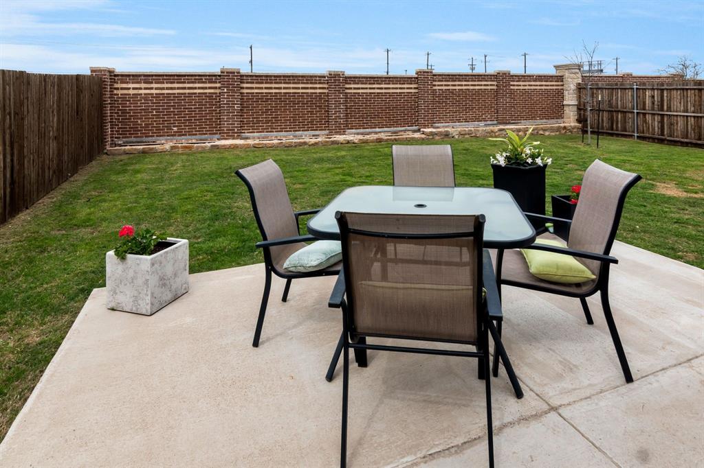 1228 Viscount Street Haslet, TX 76052 - Photo 24 of 28 a view of a chairs and table in the patio
