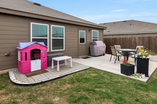 a view of a swimming pool with a patio