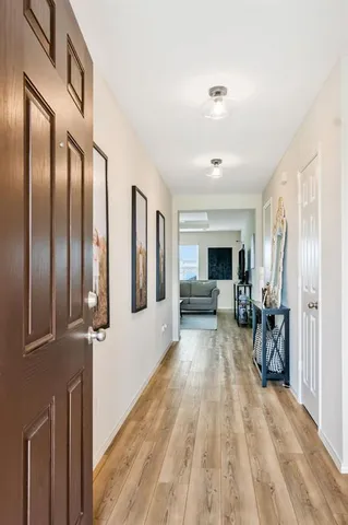 a view of livingroom with furniture and workspace