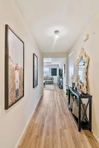a kitchen with a table chairs sink and cabinets