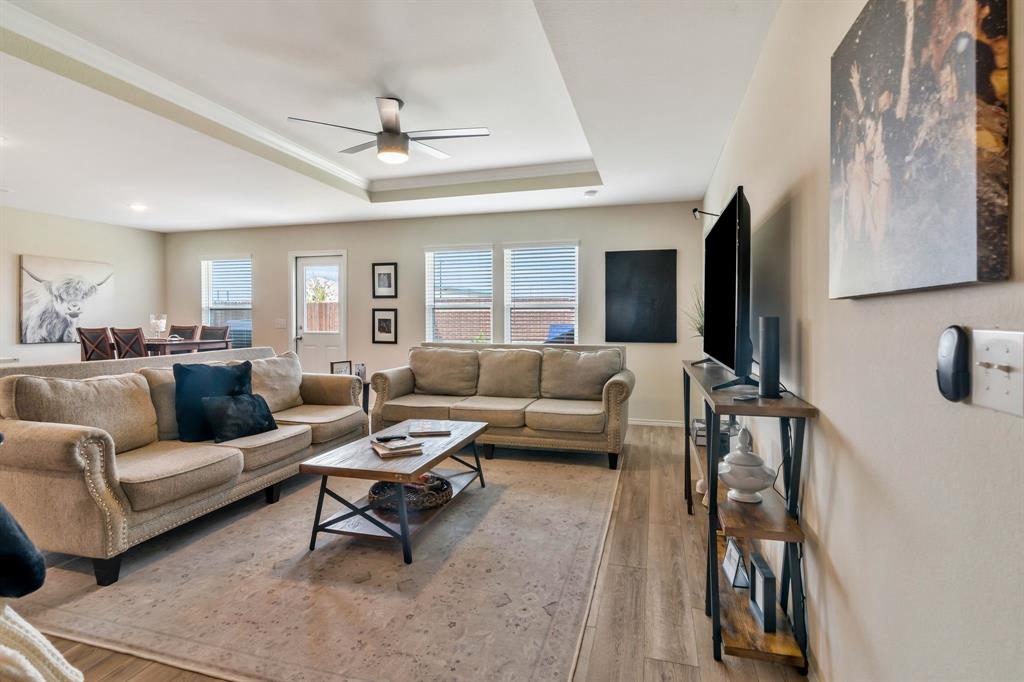 1228 Viscount Street Haslet, TX 76052 - Photo 10 of 28 a living room with furniture and a flat screen tv