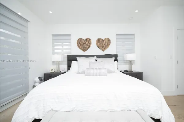 a utility room with sink dryer and washer