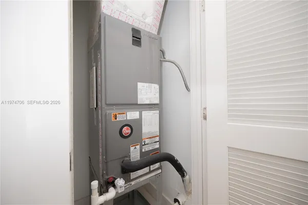 a view of a workspace with furniture and a air conditioner