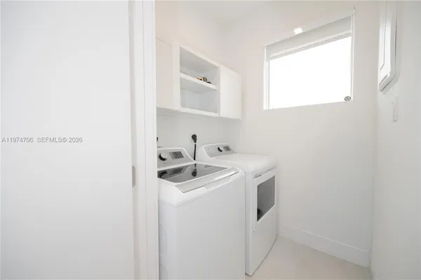 a bedroom with a bed and a cabinets