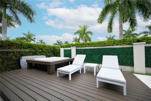 an aerial view of a house with outdoor space and lake view