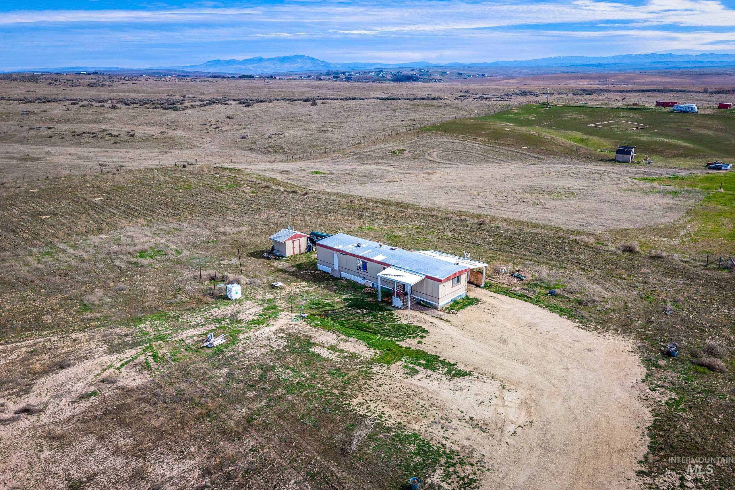 13488 Hollow Road Caldwell, ID 83607 - Photo 14 of 15 Aerial view of sparsely populated area with mountains