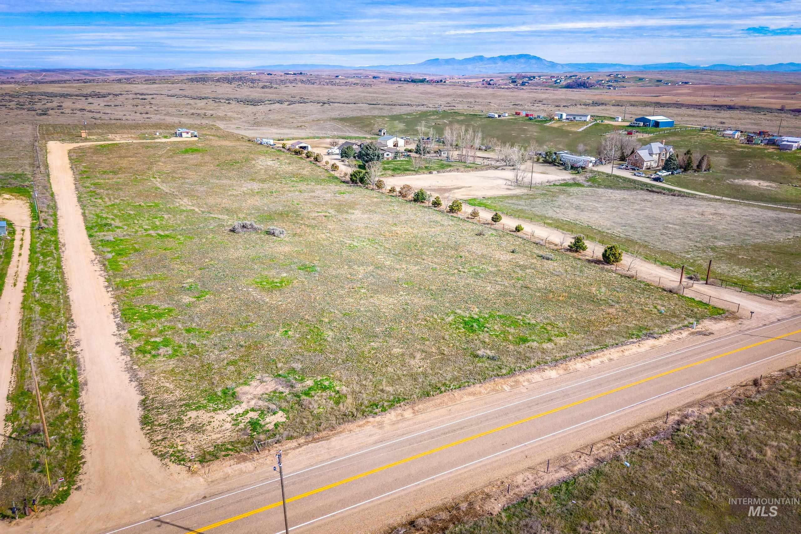 13488 Hollow Road Caldwell, ID 83607 - Photo 2 of 15 Overview of rural landscape featuring a mountain backdrop