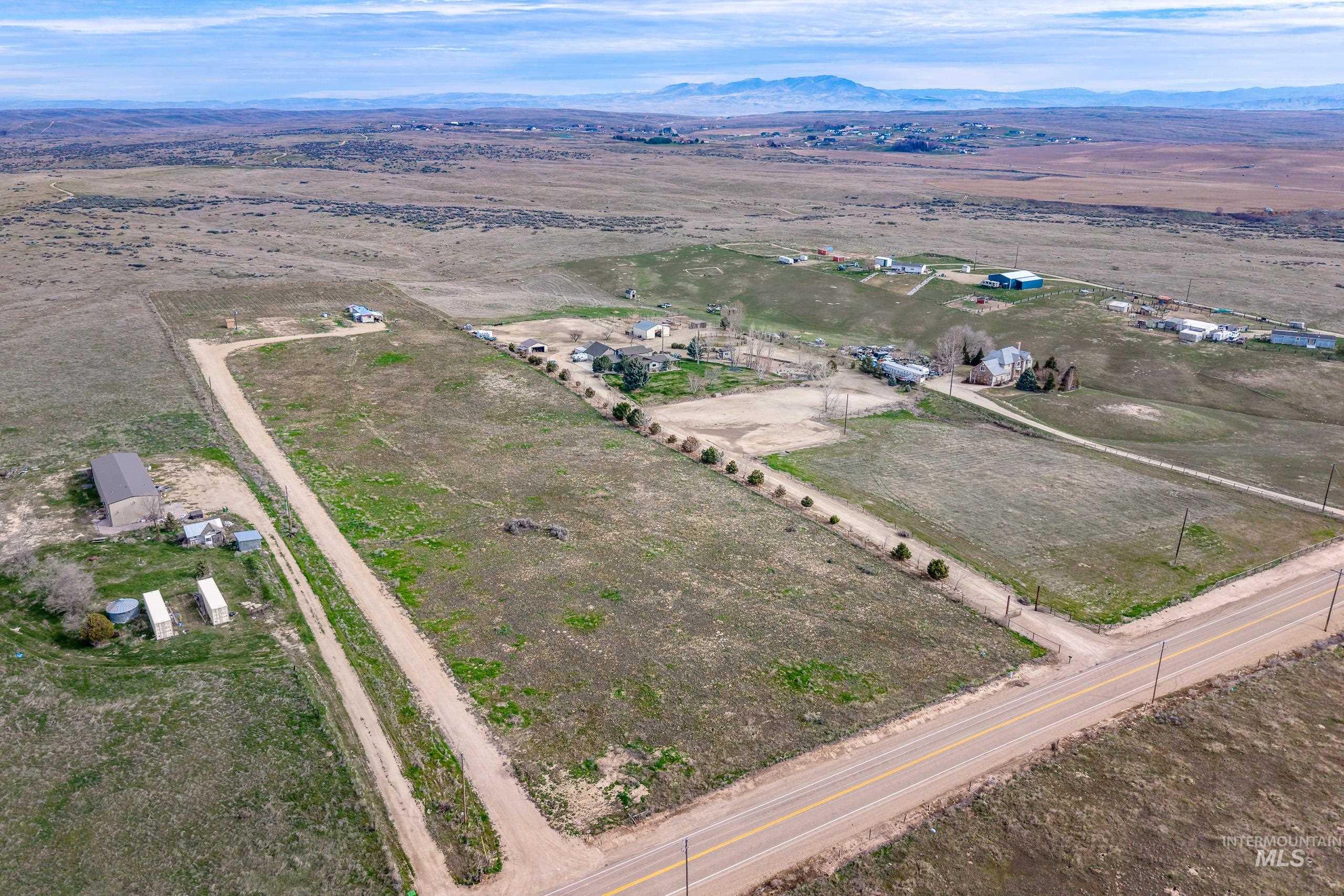 13488 Hollow Road Caldwell, ID 83607 - Photo 5 of 15 Aerial view of property's location with rural landscape and a mountainous background