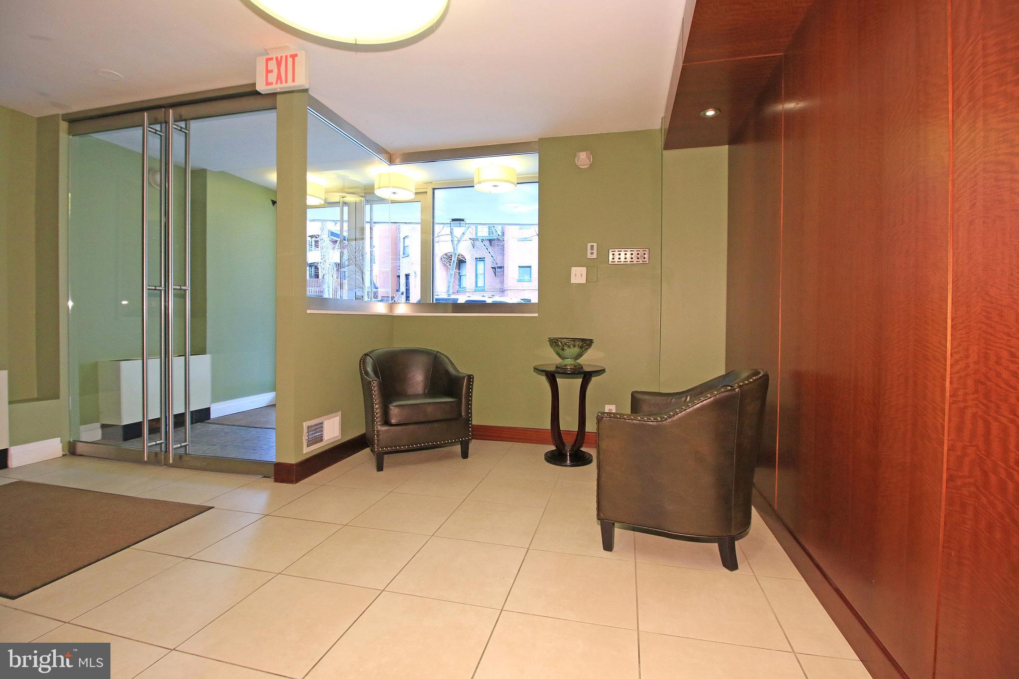 1260 21st Street Northwest, Unit 207 Washington, DC 20036 - Photo 15 of 16 a living room with furniture