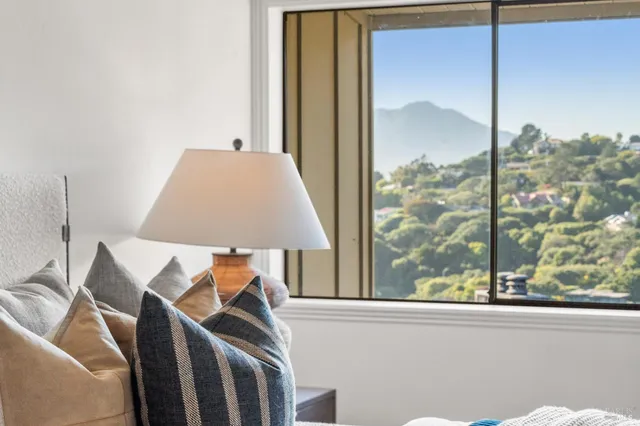 a view of a balcony with furniture and a window