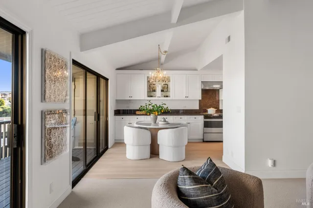 a kitchen with a refrigerator and a white cabinets