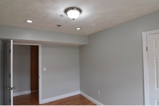 73 Hamilton Street Boston, MA 02125 - Photo 12 of 21 a view of an empty room with a window