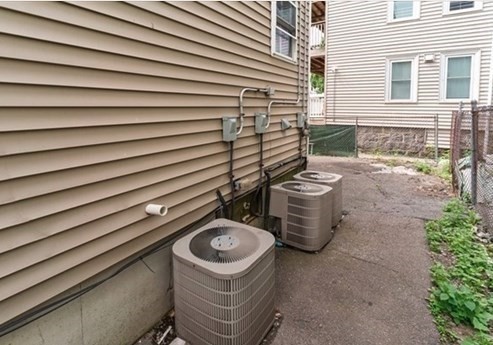 73 Hamilton Street Boston, MA 02125 - Photo 18 of 21 a view of a chair and fire pit in back yard of the house