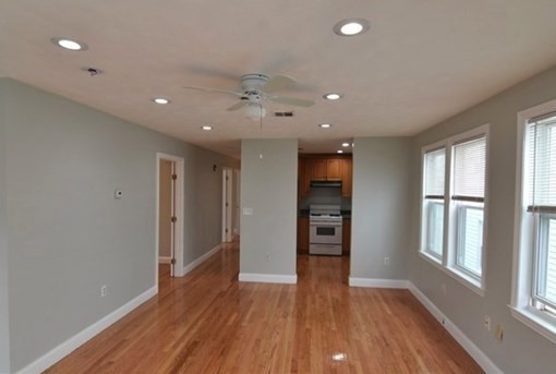 73 Hamilton Street Boston, MA 02125 - Photo 6 of 21 wooden floor in an empty room with a window
