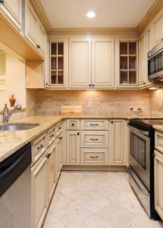 159 St Botolph Street, Unit 1 Boston, MA 02115 - Photo 3 of 8 a kitchen with stainless steel appliances granite countertop a stove and a sink