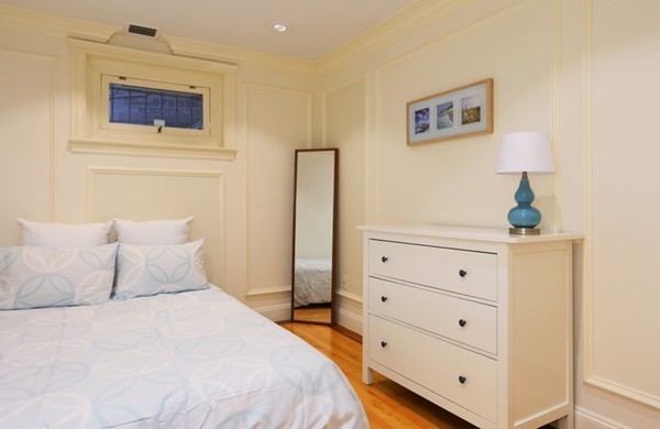 159 St Botolph Street, Unit 1 Boston, MA 02115 - Photo 4 of 8 a bedroom with a bed and a night stand