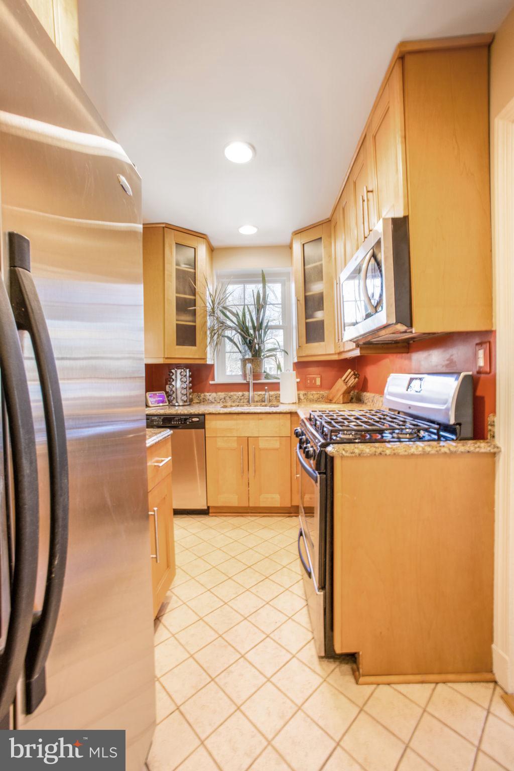 1201 Forest Glen Road Silver Spring, MD 20901 - Photo 24 of 50 Kitchen with custom wood cabinetry