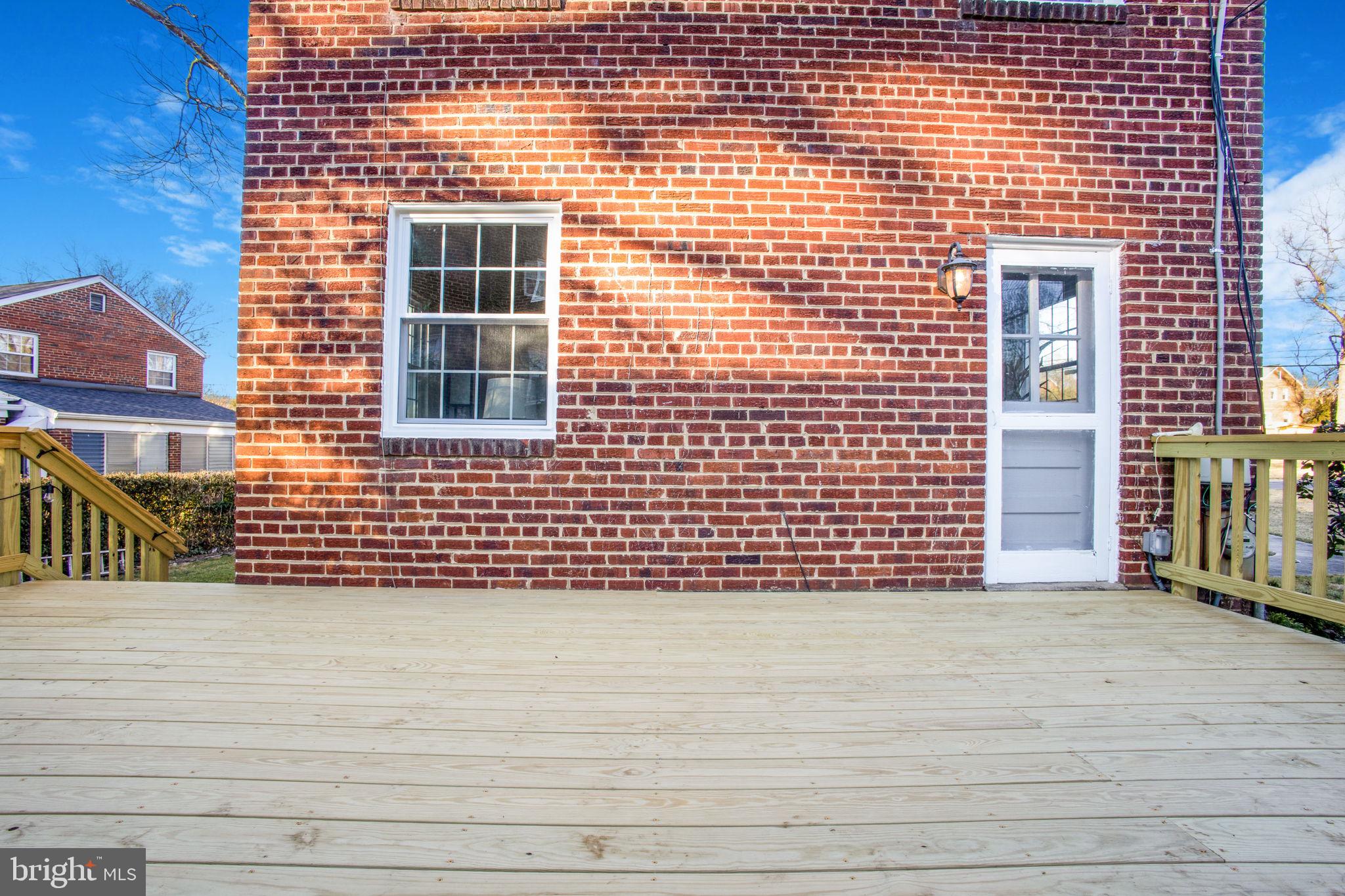 1201 Forest Glen Road Silver Spring, MD 20901 - Photo 6 of 50 Living room door leads to brand new deck