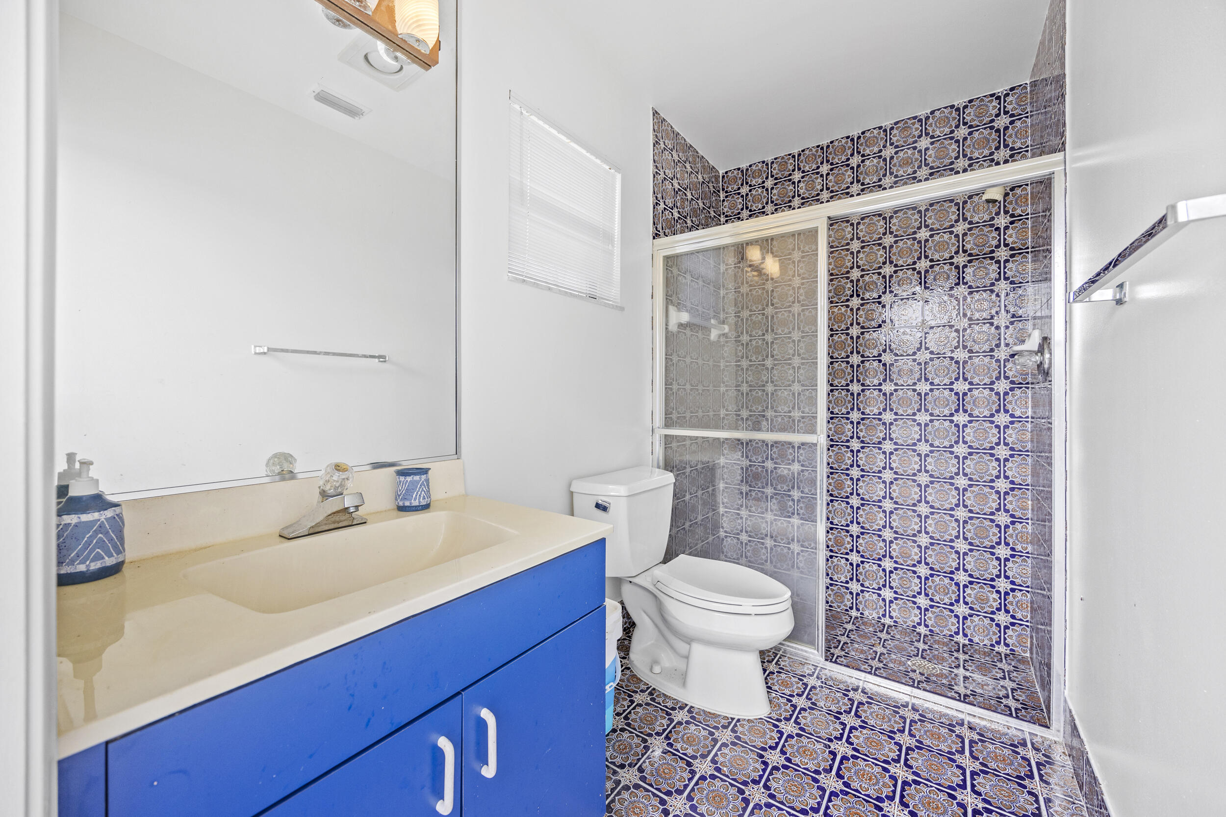10747 Stonebridge Boulevard Boca Raton, FL 33498 - Photo 42 of 75 a bathroom with a sink toilet and shower