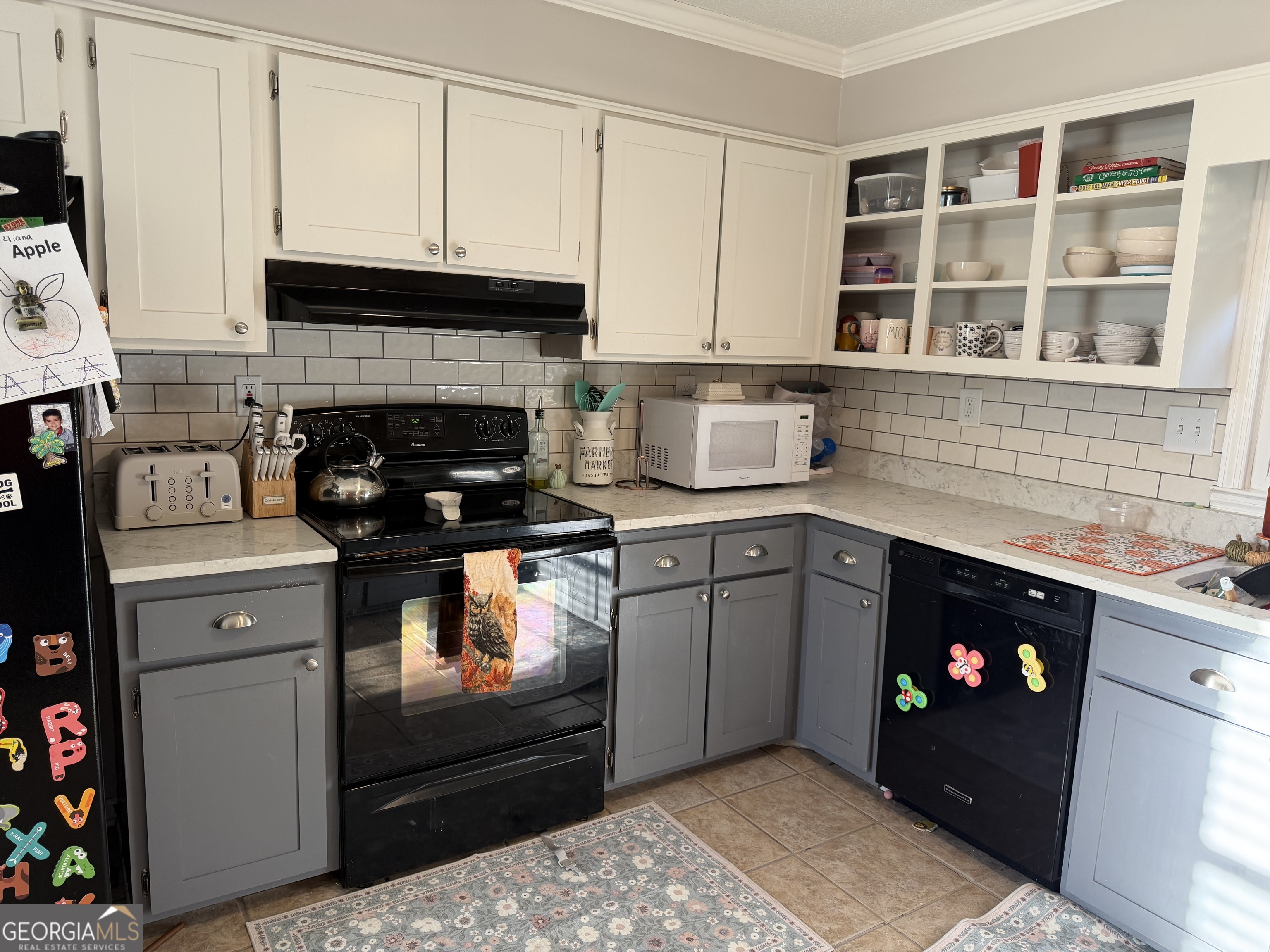 504 Payne Place Dublin, GA 31021 - Photo 12 of 22 a kitchen with a stove and cabinets