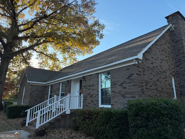 a front view of a house with stairs