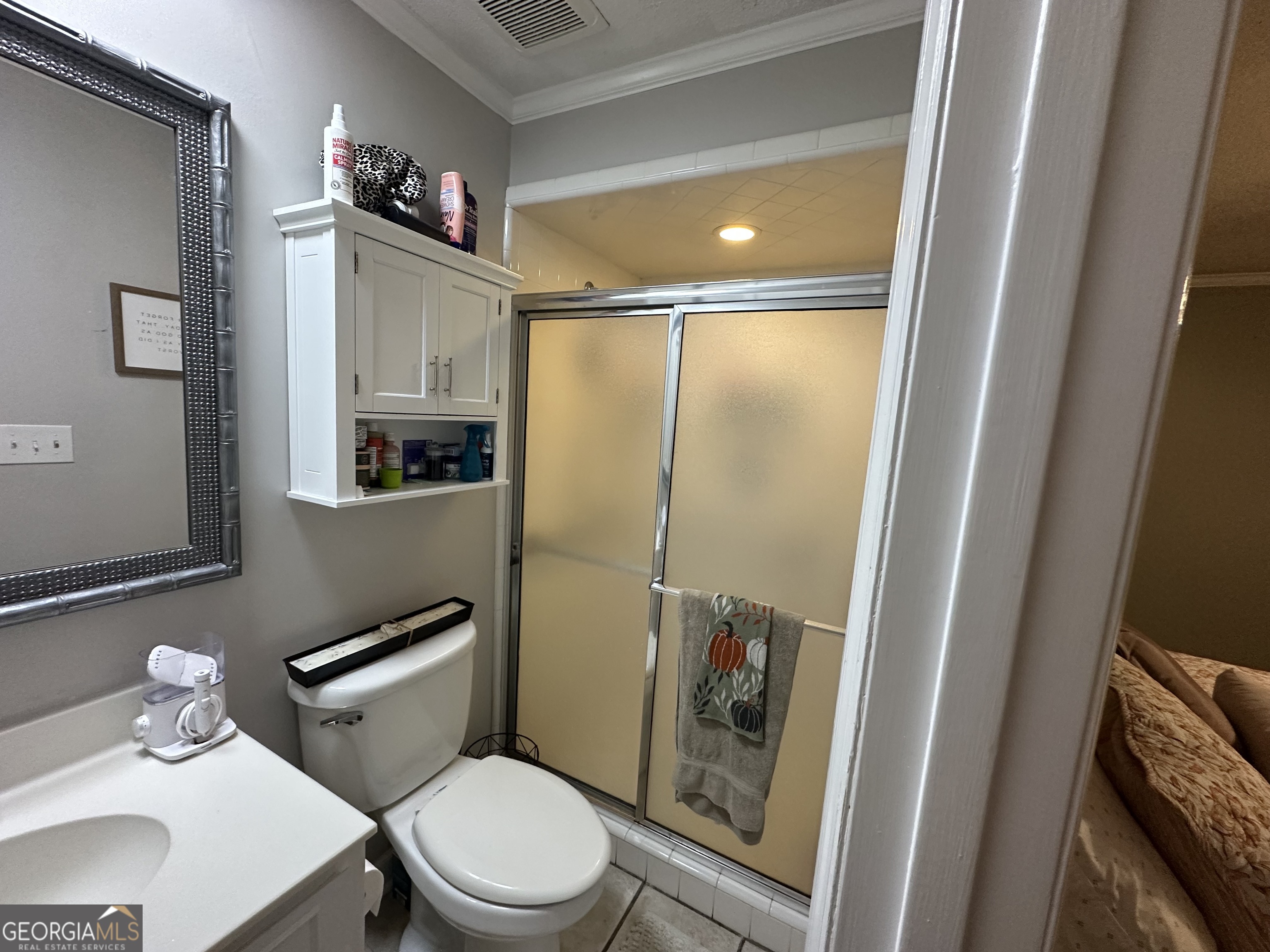 504 Payne Place Dublin, GA 31021 - Photo 22 of 22 a white toilet sitting next to a bathroom sink