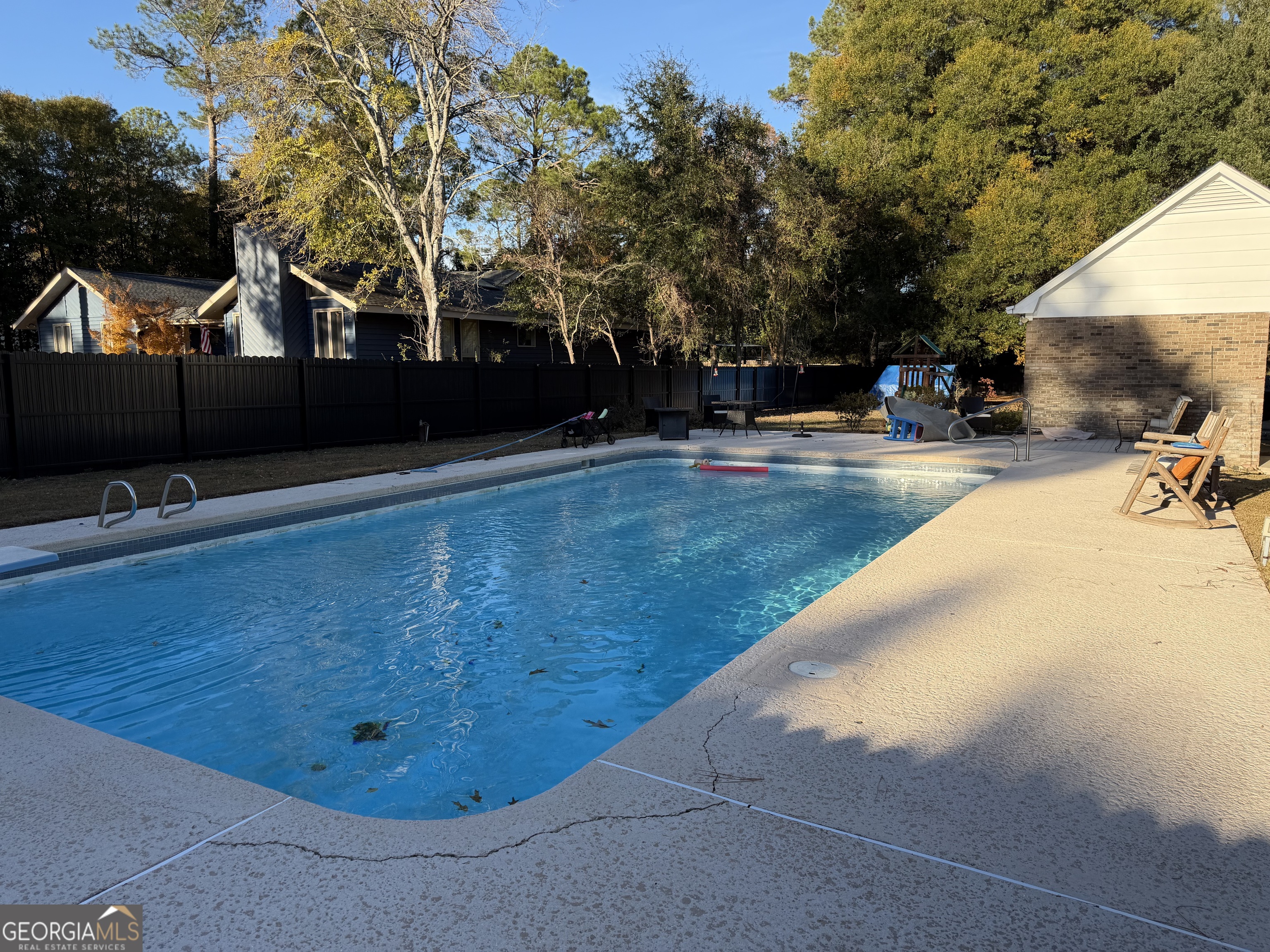 504 Payne Place Dublin, GA 31021 - Photo 6 of 22 a view of a swimming pool with an outdoor seating