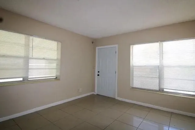 a view of an empty room with a window