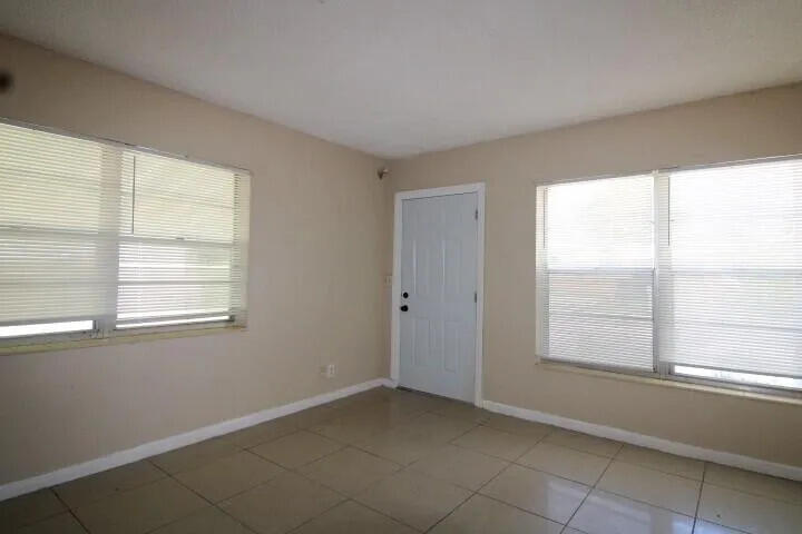 1205 West 24th Street Riviera Beach, FL 33404 - Photo 3 of 11 a view of an empty room with a window