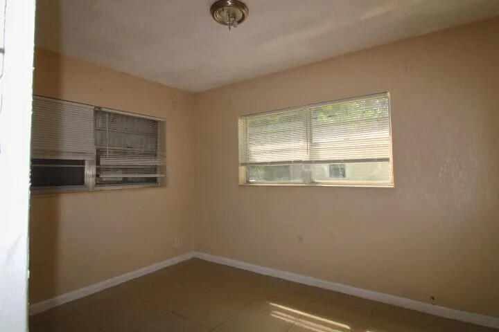 1205 West 24th Street Riviera Beach, FL 33404 - Photo 5 of 11 a view of a room that has a window in it