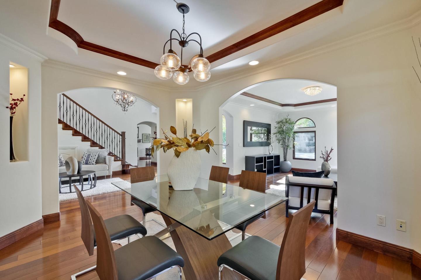 1725 Newell Road Palo Alto, CA 94303 - Photo 14 of 47 a view of a dining room with furniture wooden floor and chandelier