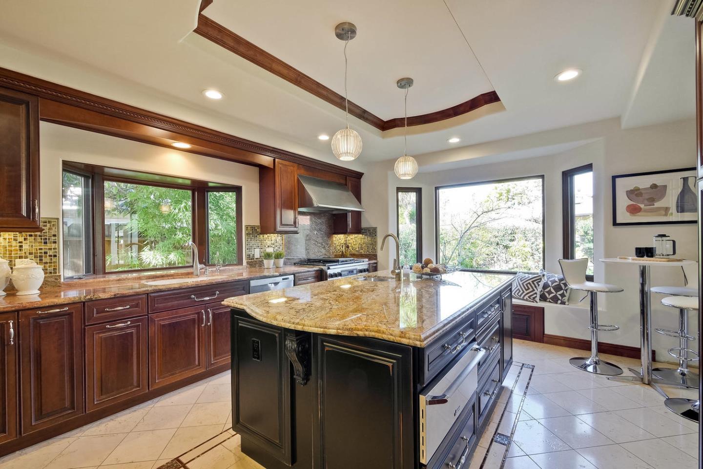 1725 Newell Road Palo Alto, CA 94303 - Photo 15 of 47 a kitchen with center island and stainless steel appliances