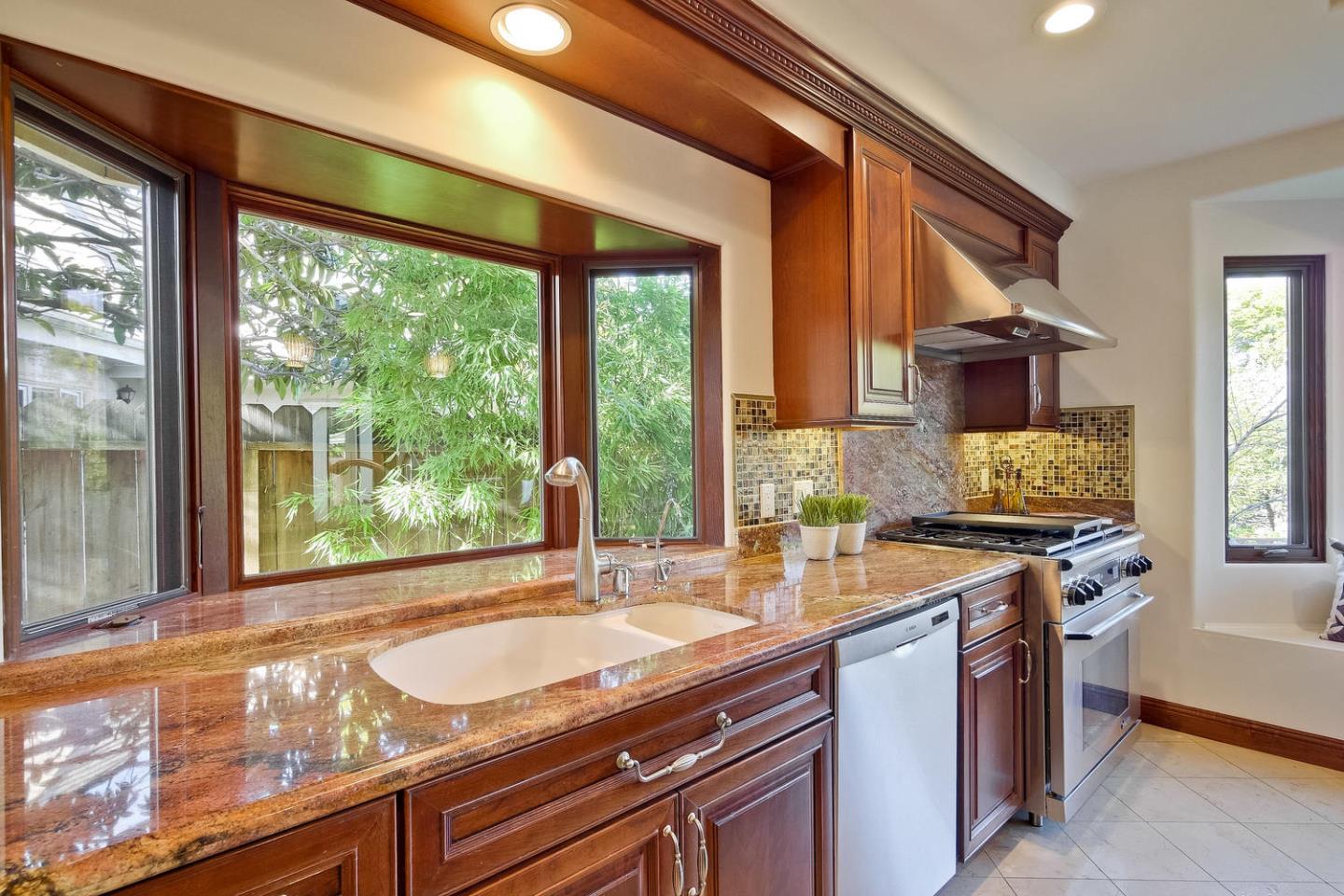1725 Newell Road Palo Alto, CA 94303 - Photo 17 of 47 a kitchen with a sink and large windows