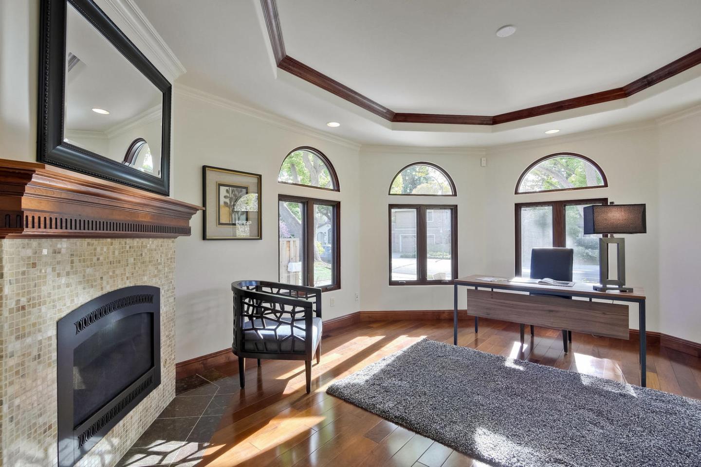 1725 Newell Road Palo Alto, CA 94303 - Photo 20 of 47 a living room with furniture and a fireplace