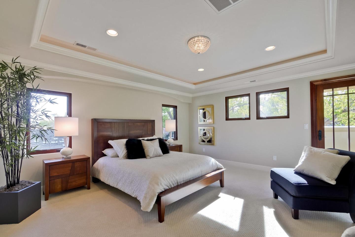 1725 Newell Road Palo Alto, CA 94303 - Photo 22 of 47 a bedroom with a bed and wooden floor