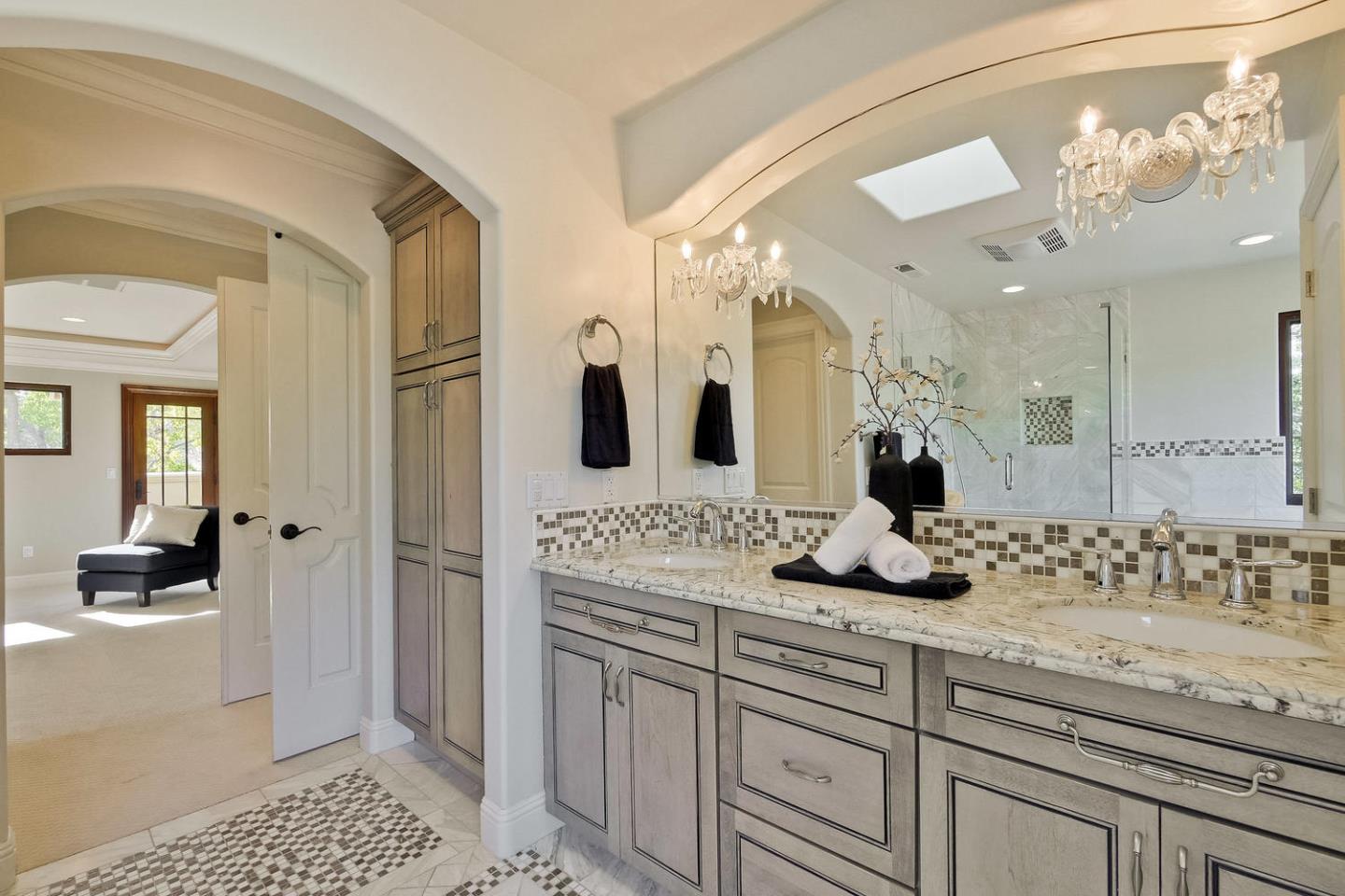 1725 Newell Road Palo Alto, CA 94303 - Photo 23 of 47 a bathroom with a sink and a mirror