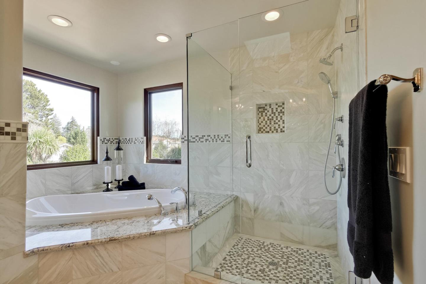 1725 Newell Road Palo Alto, CA 94303 - Photo 24 of 47 a bathroom with a granite countertop shower mirror and a bathtub